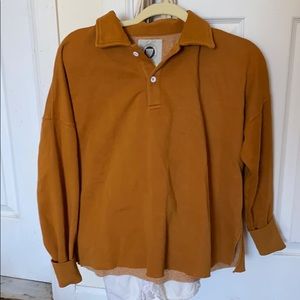Tan fleece Urban Outfitters sweatshirt.